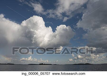 View of clouds over a lake, Lake of the Woods, Ontario, Canada View Large Photo Image Stock Photo - View of clouds over a lake, Lake of the Woods, Ontario, Canada. Fotosearch