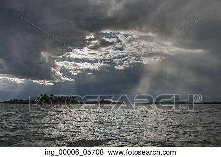 View of clouds over a lake, Lake of the Woods, Ontario, Canada View Large Photo Image Stock Photo - View of clouds over a lake, Lake of the Woods, Ontario, Canada. Fotosearch