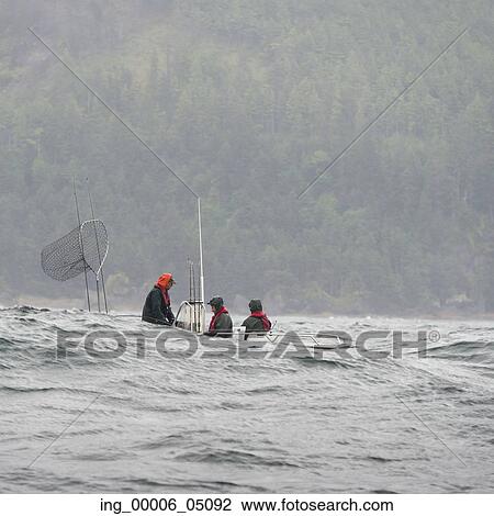 View of fishermen in a boat, Skeena-Queen Charlotte Regional District, Hippa Island, Haida Gwaii, Graham Island, British Columbia, Canada View Large Photo Image Stock Image - View of fishermen in a boat, Skeena-Queen Charlotte Regional District, Hippa Island, Haida Gwaii, Graham Island, British Columbia, Canada. Fotosearch
