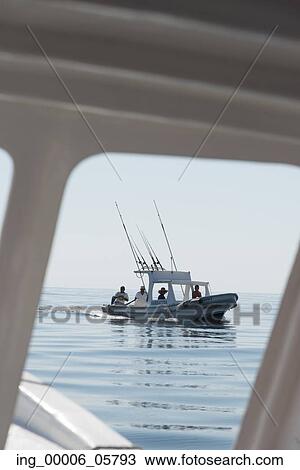 View of people fishing in a boat on the ocean, Ixtapa, Zihuatanejo, Guerrero, Mexico View Large Photo Image Stock Image - View of people fishing in a boat on the ocean, Ixtapa, Zihuatanejo, Guerrero, Mexico. Fotosearch
