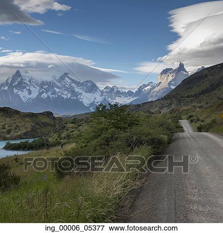 View of road with mountains in the background, Torres del Paine National Park, Patagonia, Chile View Large Photo Image Stock Photo - View of road with mountains in the background, Torres del Paine National Park, Patagonia, Chile. Fotosearch