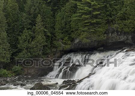 Picture - Waterfall in a forest, Plaisance Falls, Petite-Nation River, Quebec, Canada. Fotosearch
