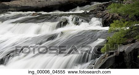 Stock Photography - Waterfall in a forest, Plaisance Falls, Petite-Nation River, Quebec, Canada. Fotosearch