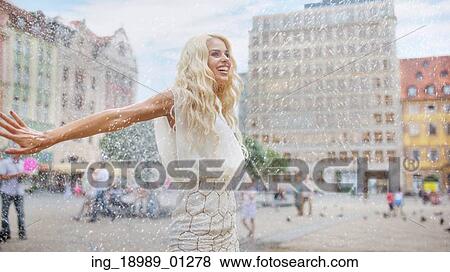 Woman dancing in the summer rain View Large Photo Image Stock Photo - Woman dancing in the summer rain. Fotosearch