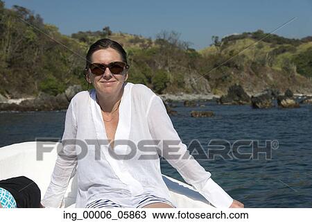 Woman enjoying relaxing on a boat, Zihuatanejo, Guerrero, Mexico View Large Photo Image Stock Image - Woman enjoying relaxing on a boat, Zihuatanejo, Guerrero, Mexico. Fotosearch
