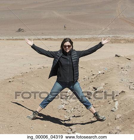 Stock Photo - Woman in desert, Los Flamencos National Reserve, San Pedro de Atacama, El Loa Province, Antofagasta Region, Chile-Bolivia Border. Fotosearch