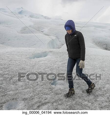 Woman walking in ice on Perito Moreno Glacier, Los Glaciares National Park, Santa Cruz Province, Patagonia, Argentina View Large Photo Image Picture - Woman walking in ice on Perito Moreno Glacier, Los Glaciares National Park, Santa Cruz Province, Patagonia, Argentina. Fotosearch
