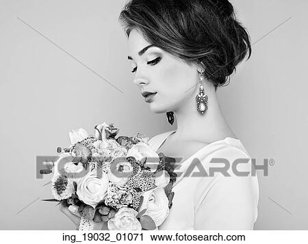 Woman with bouquet of flowers in her hands. Flowers. Spring. Bride. March 8. Fashion photo. Black and white View Large Photo Image Stock Image - Woman with bouquet of flowers in her hands. Flowers. Spring. Bride. March 8. Fashion photo. Black and white. Fotosearch