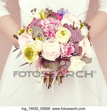 Woman with bouquet of flowers in her hands. Flowers. Spring. Bride. March 8. Fashion photo View Large Photo Image Stock Photograph - Woman with bouquet of flowers in her hands. Flowers. Spring. Bride. March 8. Fashion photo. Fotosearch