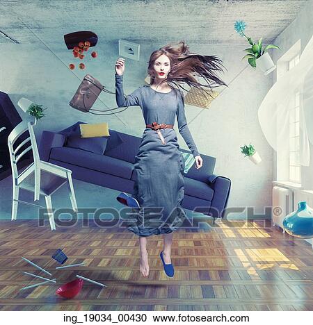 Stock Image - young beautiful lady fly in zero gravity room. Photo combination creative concept. Fotosearch