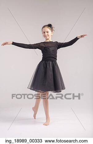 Young cute girl in the dance pose View Large Photo Image Stock Image - Young cute girl in the dance pose. Fotosearch