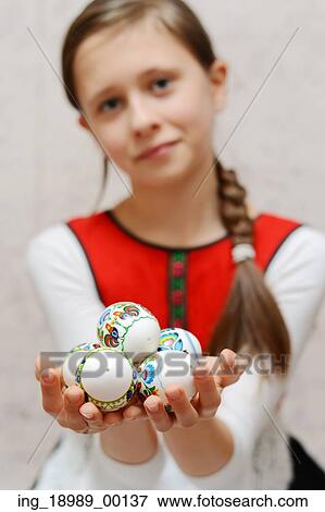 Stock Photo - Young cute girl wearing local traditional costume. Fotosearch