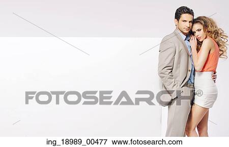 Young elegant couple with the huge white board View Large Photo Image Stock Photo - Young elegant couple with the huge white board. Fotosearch