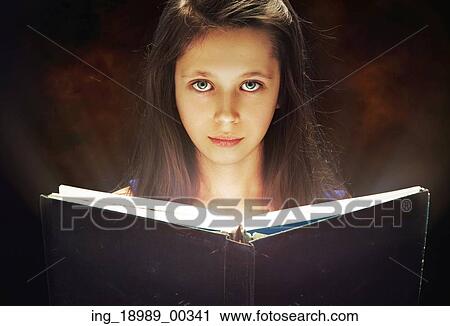 Young girl reading the old book View Large Photo Image Stock Image - Young girl reading the old book. Fotosearch