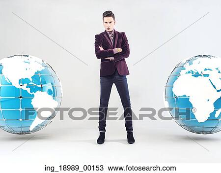 Young handsome businessman and Earth globe View Large Photo Image Stock Image - Young handsome businessman and Earth globe. Fotosearch