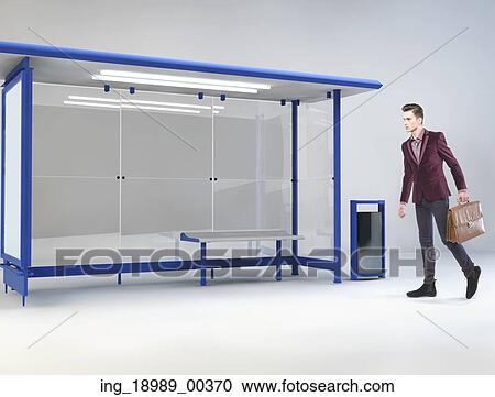 Young handsome man at a bus stop View Large Photo Image Stock Image - Young handsome man at a bus stop. Fotosearch