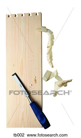Stock Image - Photograph of a chisel and peice of wood. Fotosearch