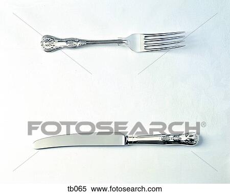 Photograph of an ornate silver knife and fork View Large Photo Image Stock Photography - Photograph of an ornate silver knife and fork. Fotosearch