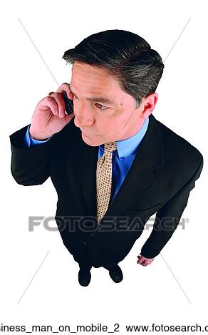 Stock Image - Business man on mobile 2. Fotosearch