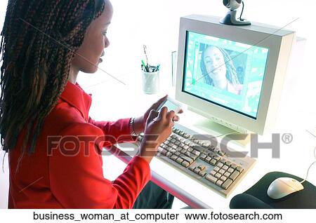 Stock Photography - Business woman at computer. Fotosearch