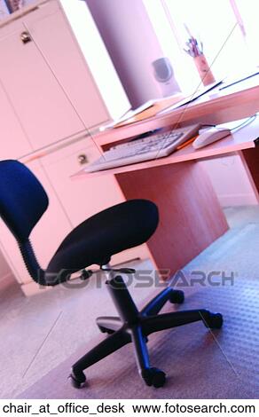 Chair at office desk View Large Photo Image Stock Image - Chair at office desk. Fotosearch
