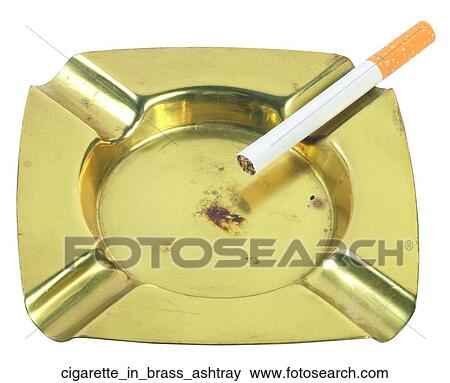 Cigarette in brass ashtray View Large Photo Image Stock Photo - Cigarette in brass ashtray. Fotosearch