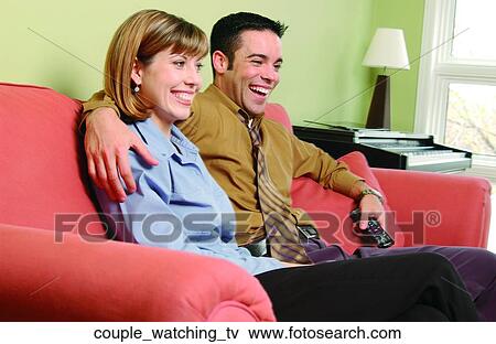 Stock Photo - Couple watching TV. Fotosearch