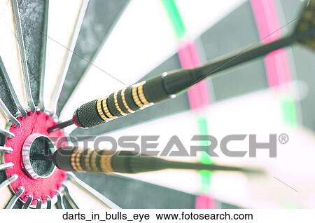 Darts in bulls eye View Large Photo Image Stock Image - Darts in bulls eye. Fotosearch