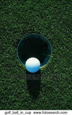 Stock Photography - Golf ball in cup. Fotosearch