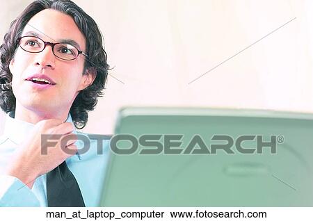 Man at laptop computer View Large Photo Image Stock Photography - Man at laptop computer. Fotosearch
