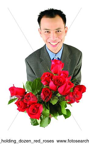 Stock Photograph - Man holding dozen red roses. Fotosearch