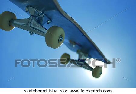 Skateboard blue sky View Large Photo Image Stock Photo - Skateboard blue sky. Fotosearch
