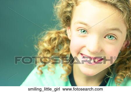 Stock Image - Smiling little girl. Fotosearch