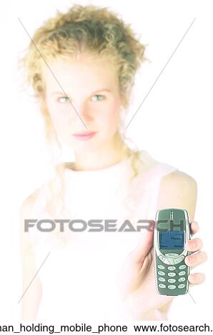 Woman holding mobile phone View Large Photo Image Stock Image - Woman holding mobile phone. Fotosearch