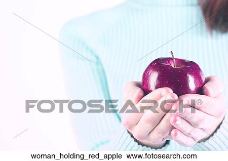 Woman holding red apple View Large Photo Image Stock Image - Woman holding red apple. Fotosearch