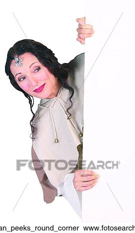 Stock Photography - Woman peeks round corner. Fotosearch