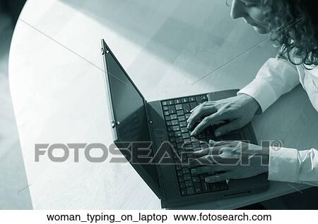 Stock Photography - Woman typing on laptop. Fotosearch