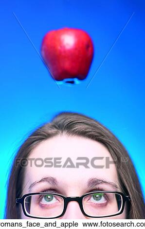 Womans face and apple View Large Photo Image Stock Image - Womans face and apple. Fotosearch