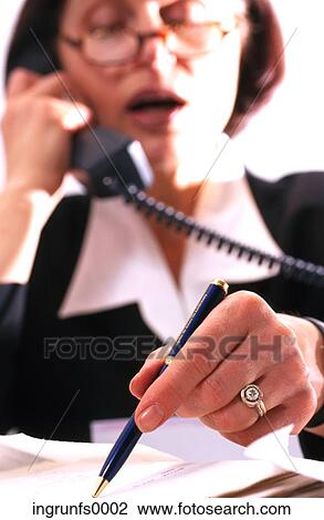 Business Woman on Phone Looking at Document at Desk View Large Photo Image Stock Image - Business Woman on Phone Looking at Document at Desk. Fotosearch