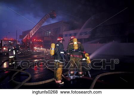 Firemen Fighting a Fire View Large Photo Image Stock Photo - Firemen Fighting a Fire. Fotosearch