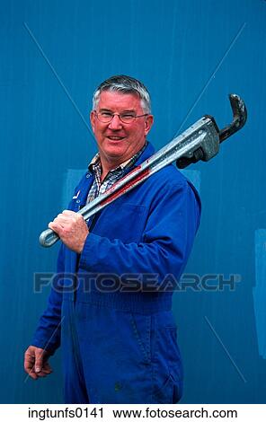 Happy Man With Huge Wrench View Large Photo Image Stock Image - Happy Man With Huge Wrench. Fotosearch