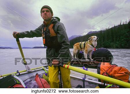 Stock Image - River Rafting Guide on Copper River in Alaska. Fotosearch