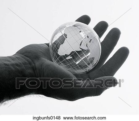 Stock Photo - The Whole World in his Hand. Fotosearch