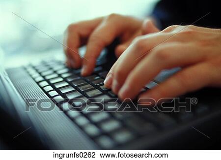 Stock Image - Typing on a Keyboard. Fotosearch