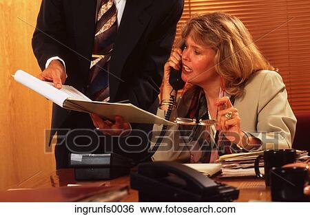 Woman on Phone at Desk View Large Photo Image Stock Photograph - Woman on Phone at Desk. Fotosearch