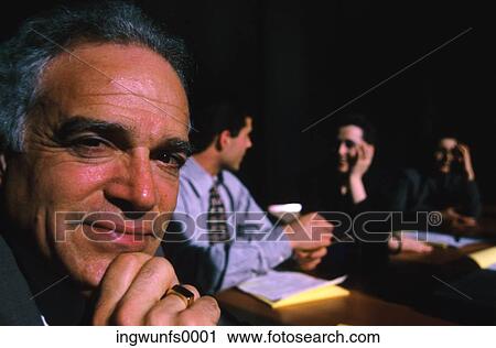 Stock Image - Business Man at Meeting. Fotosearch