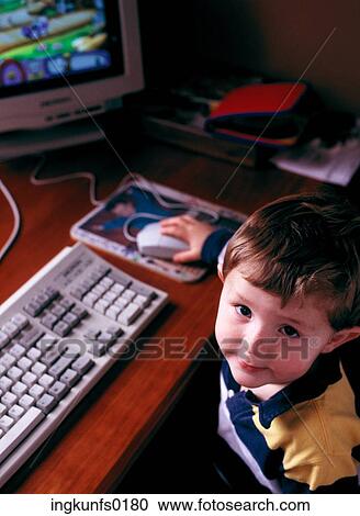 Stock Image - Child on Computer. Fotosearch