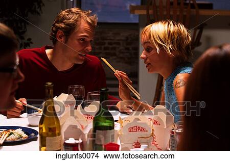 Picture - Couple at Dinner Party. Fotosearch