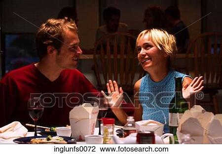 Stock Image - Couple at Dinner Party. Fotosearch