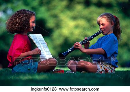 Stock Photo - Girls Playing Music. Fotosearch